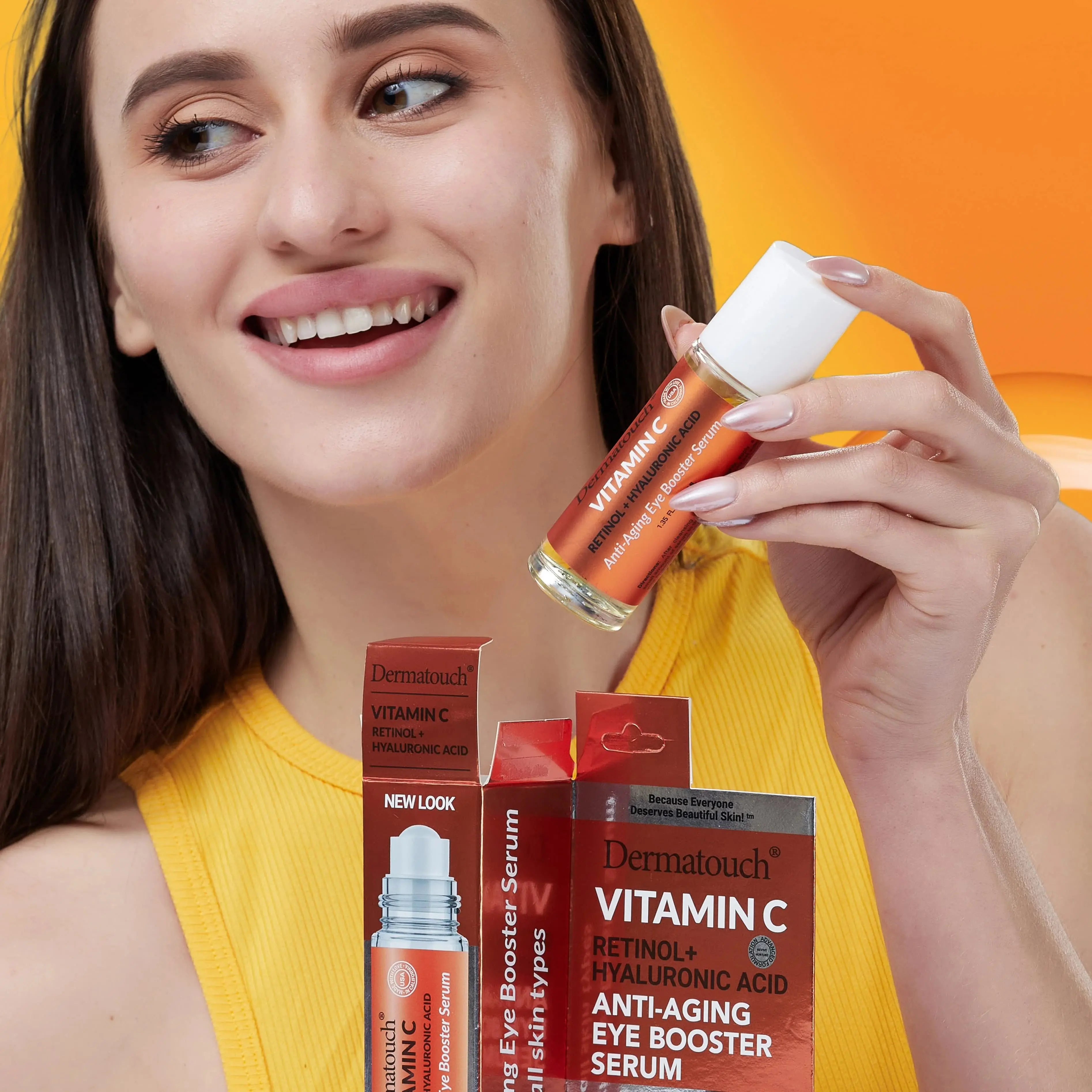 Woman holding a bottle of Dermatouch Vitamin C skincare